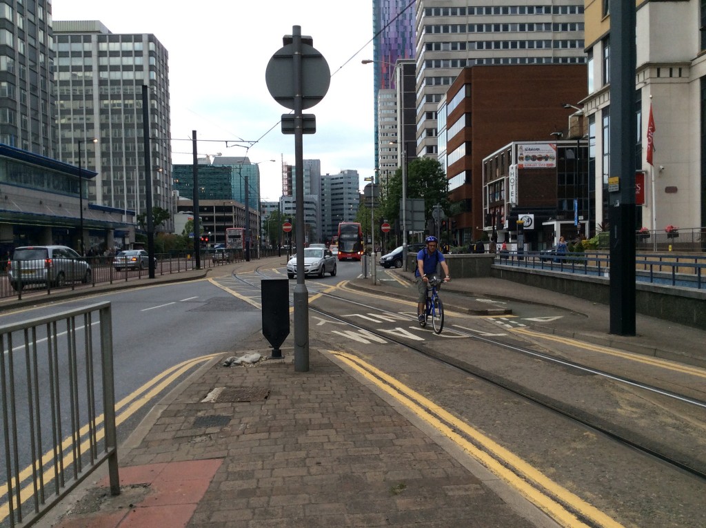 A cyclist taking the most pragmatic - albeit risky - route up Wellesley Road